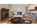 Bright living room with a decorative fireplace, hardwood floors, and stylish decor for a welcoming atmosphere at 840 S Vance St # A, Lakewood, CO 80226