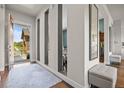 Stylish foyer with a modern design, featuring an open entrance and hardwood floors at 8142 S Langdale Way, Aurora, CO 80016