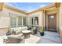 Cozy outdoor patio with comfortable seating, ideal for relaxing or entertaining guests at 8142 S Langdale Way, Aurora, CO 80016