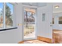 Front door of home with view of landscaped yard and porch at 1273 S Jackson St, Denver, CO 80210