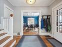 Inviting entryway with hardwood floors and views into a blue dining room at 724 N Franklin St, Denver, CO 80218