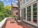Outdoor patio featuring brick flooring, seating, and French doors leading indoors at 724 N Franklin St, Denver, CO 80218