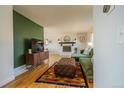 Bright living room with hardwood floors and a decorative fireplace at 4328 S Carr Ct, Littleton, CO 80123