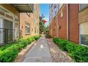 Walkway between buildings with lush green landscaping at 7240 W Custer Ave # 301, Lakewood, CO 80226