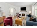 Cozy living room featuring a fireplace, hardwood floors, and stylish decor at 720 S Clayton St, Denver, CO 80209