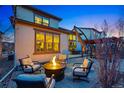 Backyard features an outdoor kitchen with a fire pit and pergola at 15275 W La Salle Ave, Lakewood, CO 80228
