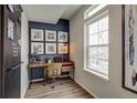 Cozy office space with a desk, chair, and a window allowing natural light to flow in at 1163 Highview Dr, Erie, CO 80516