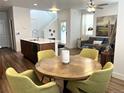 Cozy living space with an open layout, featuring a dining area and comfortable seating for relaxed gatherings at 9756 Ash Ln, Thornton, CO 80229