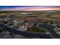 Serene aerial shot of a neighborhood showcasing well-maintained homes, winding streets, and surrounding open spaces at 15994 La Plata Peak Pl, Broomfield, CO 80023