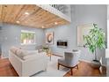 Cozy living room with hardwood floors, modern fireplace, and stylish furniture at 13245 Shoshone St, Denver, CO 80234
