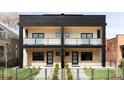 Modern two-story duplex with brick facade, black accents, and private balconies at 425 S Pearl St, Denver, CO 80209