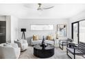 Comfortable living room with neutral tones, ample seating, and natural light from a large window at 425 S Pearl St, Denver, CO 80209