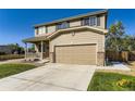 Beautiful home showcasing a well-manicured lawn and a spacious two-car garage at 5090 Miriam Ln, Parker, CO 80134