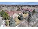 Expansive aerial view of the property showcasing the large, well-maintained lawn and mature trees in a neighborhood at 6068 W Utah Ln, Lakewood, CO 80232