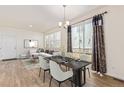 An elegant dining room with sliding glass doors, stylish curtains, and views of the backyard at 21821 E 7Th Ave, Aurora, CO 80018