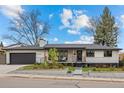 Charming single-story home featuring a landscaped front yard and an attached garage at 2905 Regis Dr, Boulder, CO 80305