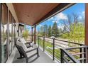 Inviting front porch with comfortable seating, perfect for relaxing outdoors at 2905 Regis Dr, Boulder, CO 80305