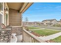 View from the cozy front porch, overlooking the well-kept neighborhood at 3778 Happyheart Way, Castle Rock, CO 80109