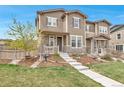 Attractive home with a nicely landscaped yard and inviting front porch at 3778 Happyheart Way, Castle Rock, CO 80109
