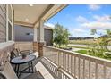 Inviting front porch with seating area, perfect for relaxing and enjoying the outdoors at 15957 E Elk Pl, Denver, CO 80239