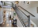 Elegant entryway with staircase and hardwood floors at 8444 E 55Th Pl, Denver, CO 80238