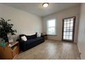 Small living room featuring a sofa and side table at 3327 Navajo St, Denver, CO 80211