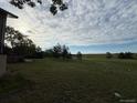 Vast backyard with mature trees and open space, perfect for outdoor activities and enjoying nature at 17852 E Long Ave, Centennial, CO 80016