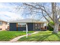 Charming single-story home with a well-manicured lawn and inviting curb appeal at 2276 Newland St, Edgewater, CO 80214