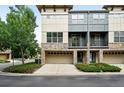 Stylish townhome with a two-car garage, stone accents, and attractive landscaping at 13524 Via Varra, Broomfield, CO 80020