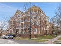 A charming multi-story brick condo building with inviting balconies, an ideal urban dwelling at 3000 E 16Th Ave # 320, Denver, CO 80206