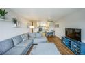 Open-concept living area flowing into dining space and updated kitchen at 3240 Iris Ave # G409, Boulder, CO 80301
