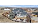 Aerial view of backyard, featuring an outdoor living area and lush landscaping at 12092 S Great Plain Ct, Parker, CO 80134