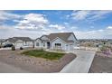 Beautiful single-story home with a long driveway and well-kept landscaping at 16122 Emporia Way, Brighton, CO 80602