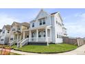 Inviting two-story home with a covered front porch and neatly maintained lawn at 251 Washington St, Erie, CO 80516