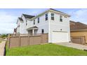 Stylish two-story house with an attached garage and well-kept lawn at 251 Washington St, Erie, CO 80516