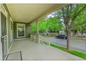 Spacious front porch provides an inviting outdoor space to relax and enjoy the neighborhood at 9270 107Th E Pl, Commerce City, CO 80640
