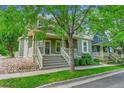 Charming home with well-kept lawn, a cozy front porch and rock garden at 9270 107Th E Pl, Commerce City, CO 80640