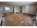 Open-concept living room with large windows, primed for personalized updates and design at 16180 E Flora Pl, Aurora, CO 80013