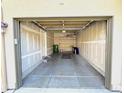 Spacious two-car garage with exposed drywall and concrete flooring, ready for storage and vehicles at 11983 W Long Cir # 203, Littleton, CO 80127