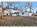 Backyard with detached garage and large grassy area at 1765 Ingalls St, Lakewood, CO 80214