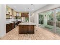 Beautiful kitchen with island, granite countertops, and stainless steel appliances at 1848 W 68Th Ave, Denver, CO 80221