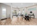 Inviting living and dining area with large windows and stylish decor at 1848 W 68Th Ave, Denver, CO 80221