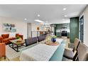 Bright dining area adjacent to kitchen and living room, perfect for entertaining guests at 10431 Holland St, Broomfield, CO 80021