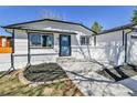 Inviting front entrance with a stylish blue door and a well-maintained walkway at 10431 Holland St, Broomfield, CO 80021