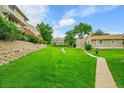 Beautifully maintained lawn and landscaping surrounding these townhomes at 3890 S Atchison Way # B, Aurora, CO 80014