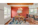 Inviting dining room featuring a wooden table, modern lighting, and a brightly painted accent wall at 105 S High St # A, Breckenridge, CO 80424