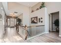 Bright foyer featuring a soaring ceiling, hardwood floors, stairway and decorative accents at 2600 Reserve Ct, Erie, CO 80516