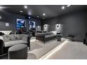 Home theater with comfortable seating, dim lighting, and a projector for an immersive viewing experience at 267 S Clermont St, Denver, CO 80246