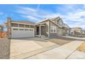 Charming two-story home featuring a two-car garage and modern architecture at 9283 Biscay St, Commerce City, CO 80022