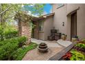 Inviting front entrance with stone accents, decorative plants, and a charming water fountain at 9266 E 35Th Ave, Denver, CO 80238